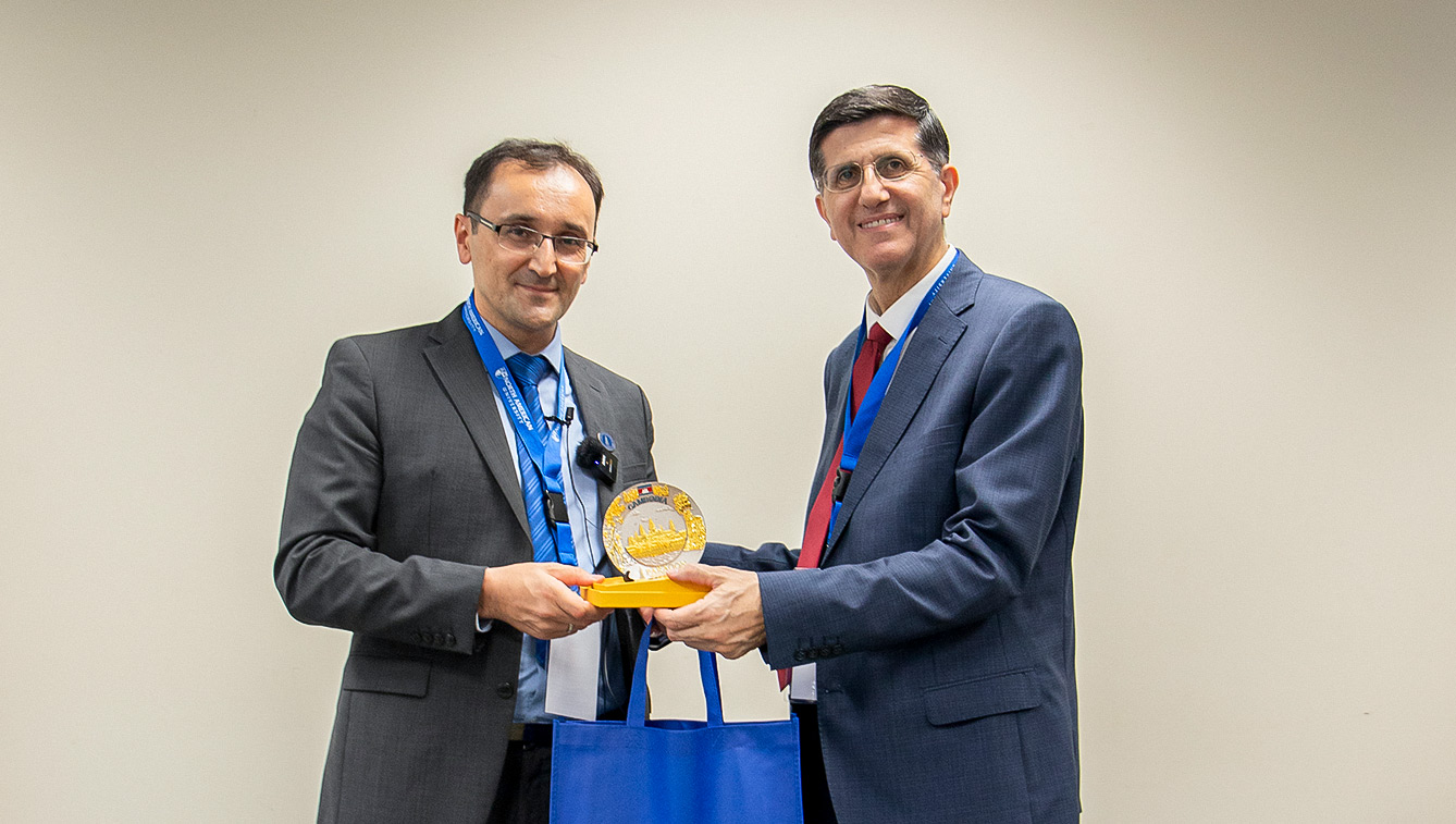 aic25 Dr. Taban receiving an award at the AIC 2025