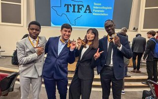 NAU's speech and debate team posing with their medals