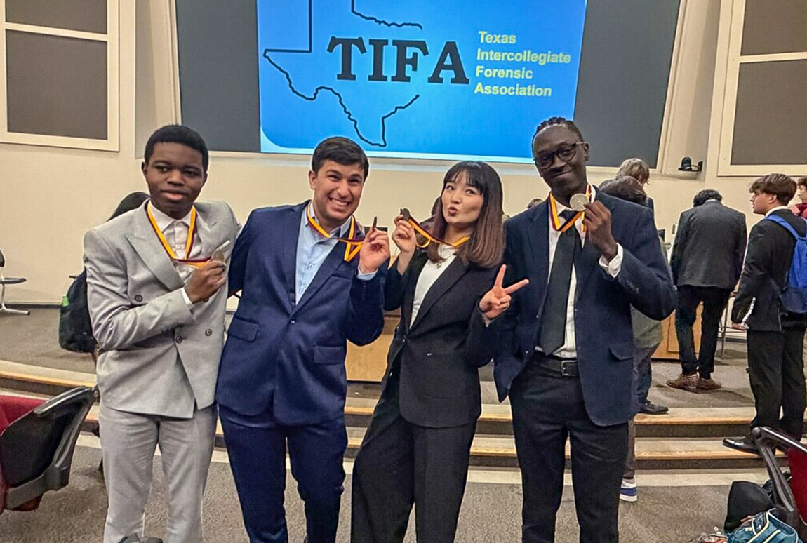 speechdebate NAU's speech and debate team posing with their medals